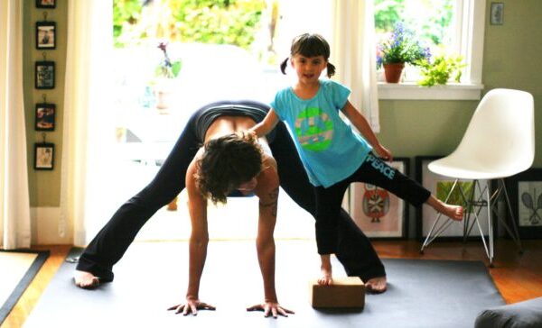 Yoga mom and daughter on Manduka mat