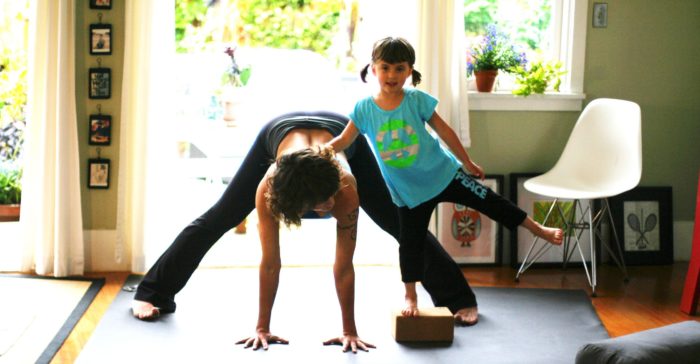 Yoga mom and daughter on Manduka mat