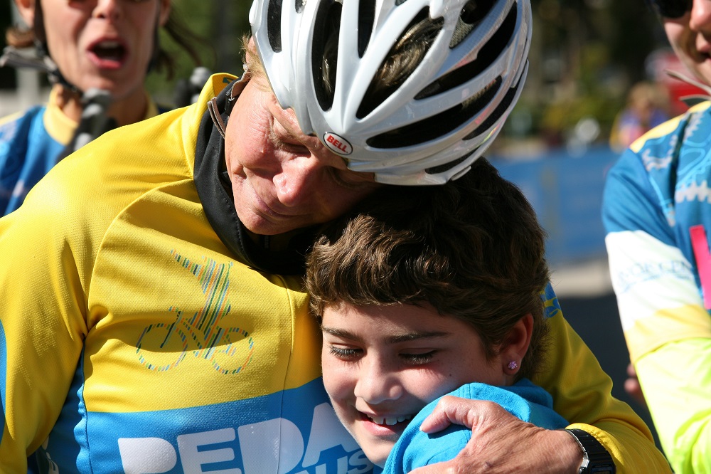 Teri Griege at the finish line of Pedal the Cause