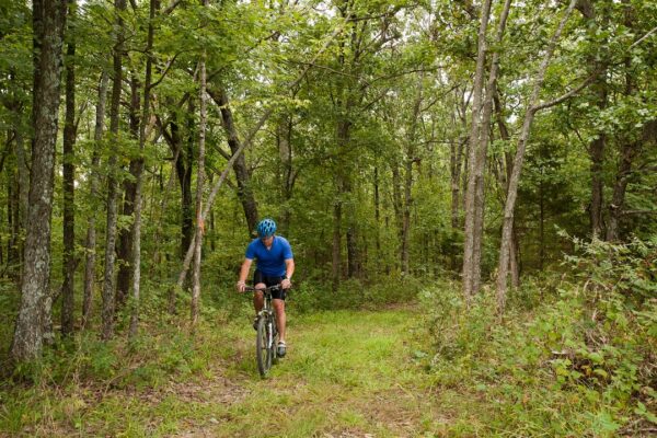 A cyclist rides the trails at Canaan Conservation Area