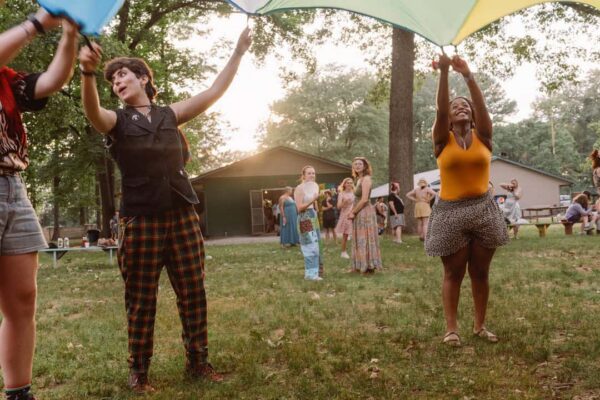 Teens at Camp Indigo Point enjoy outdoor activities among friends.