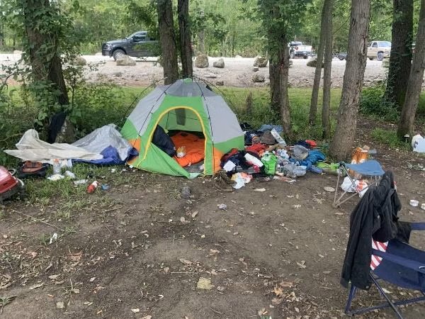 Trash scattered around camp
